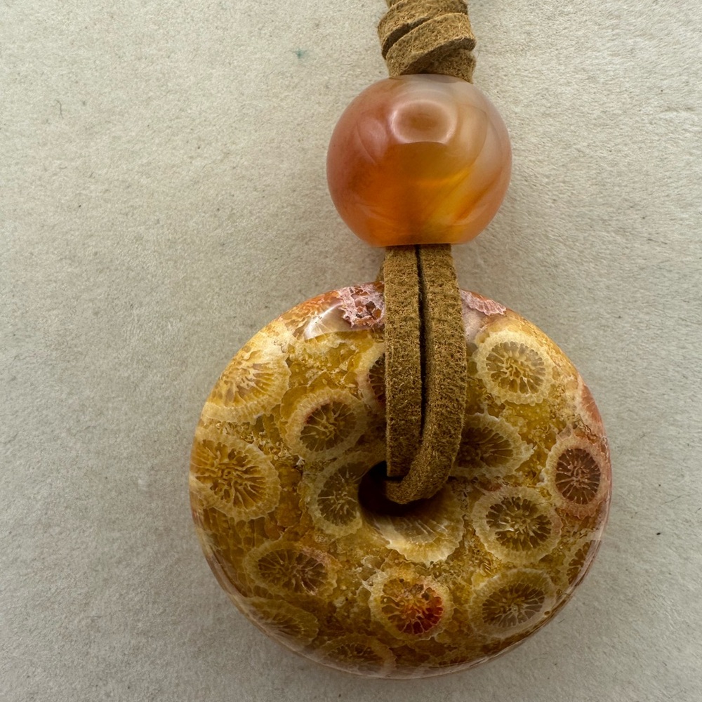 Brown and Tan Coral Fossil Donut Pendant Necklace on Brown Faux Suede - Picture 12 of 13